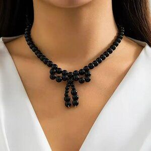 Black bead bow necklace